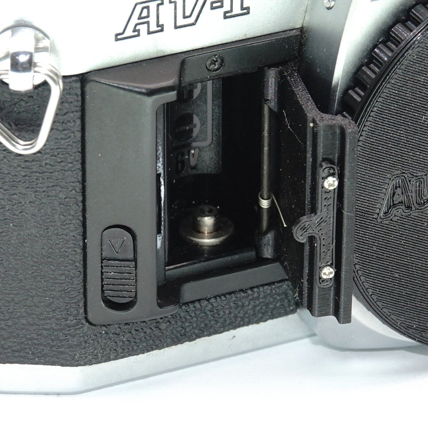 Battery compartment cover for Canon AV-1